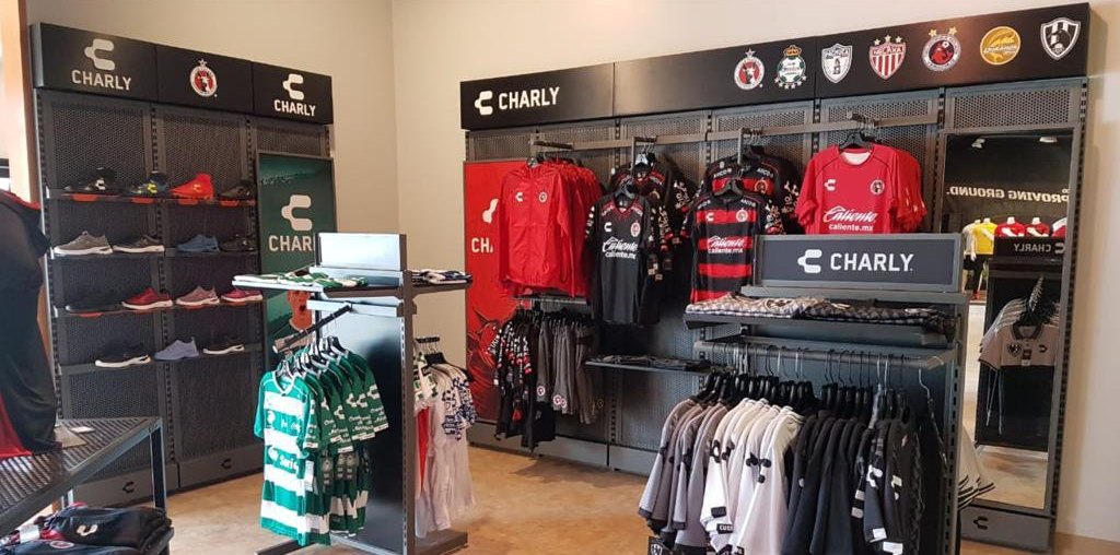 Charly branded footwear and jersey displays in a retail store