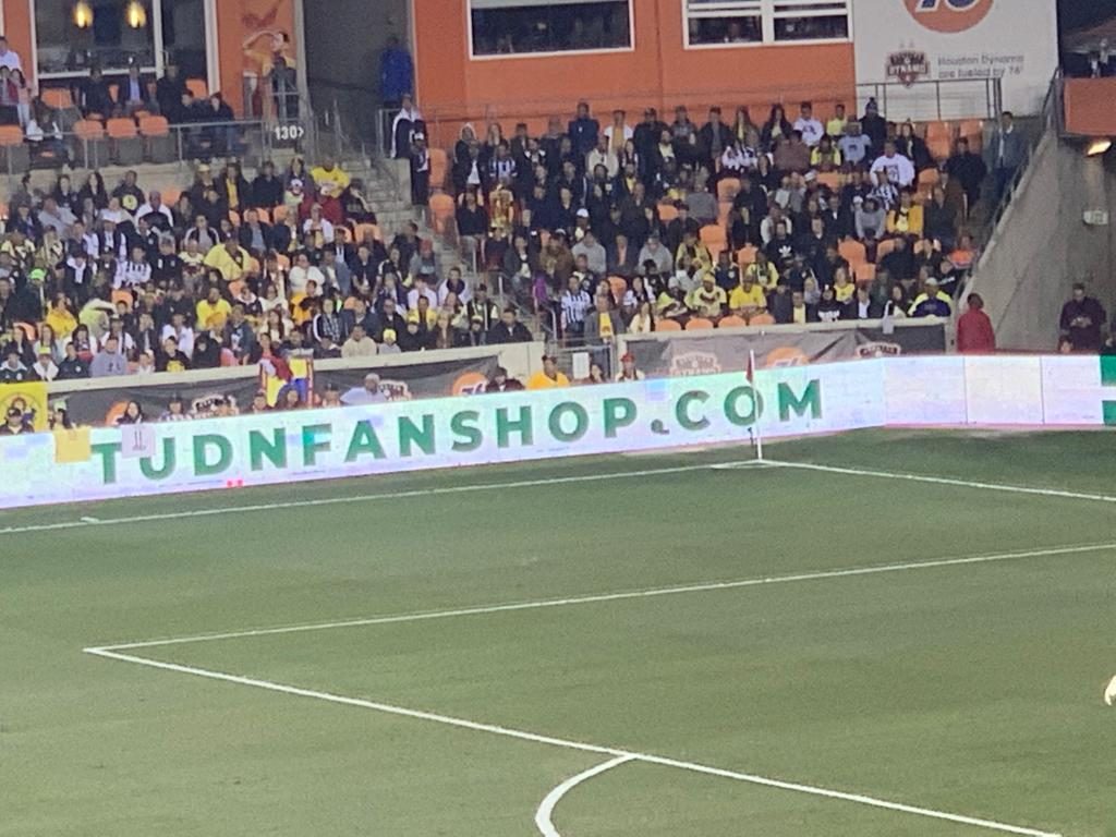 TUDNFANSHOP.COM signage on stadium LED boards during a match